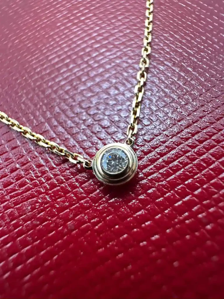 Close-up of the Cartier D'Amour Mini Pendant brilliant-cut diamond in 18k yellow gold
