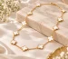 Gold clover motif necklace in a gift box, similar to a Vintage Alhambra necklace