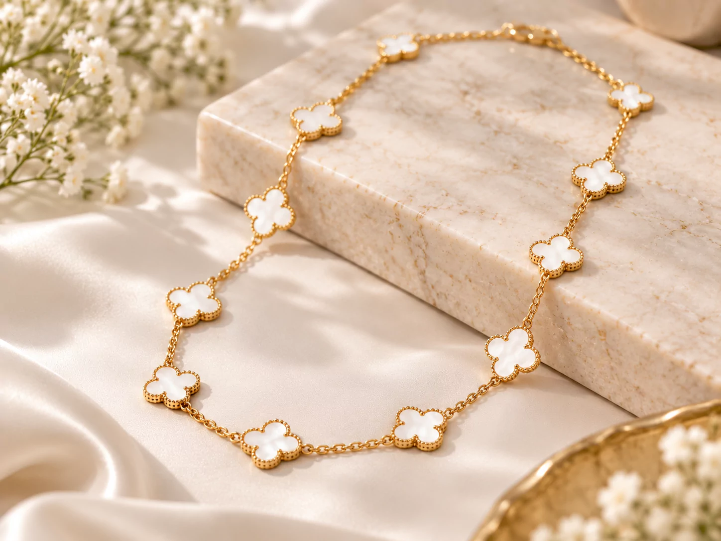 Gold clover motif necklace in a gift box, similar to a Vintage Alhambra necklace
