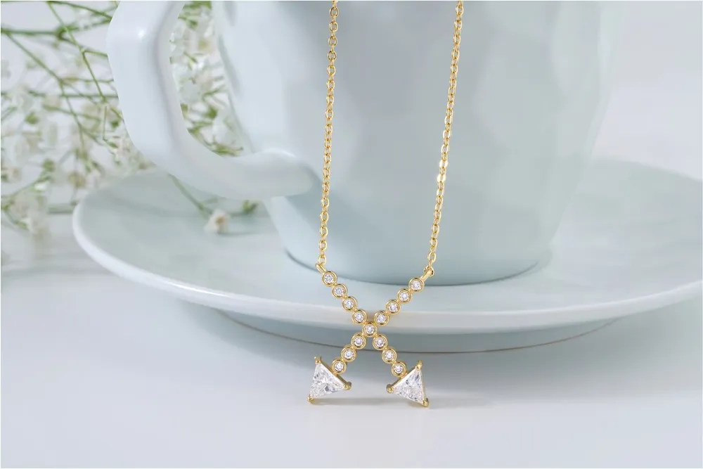 Gold necklace with diamond accents showing how floating diamonds catch the light