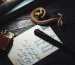 Bvlgari Serpenti bracelet style: a gold snake-shaped bracelet coiled on a dark wooden table