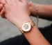 Bvlgari Serpenti watch vs Cartier Panthere: a rose gold ladies watch with a skeleton dial on a woman's wrist