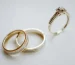 Cartier Love ring vs wedding band: two gold wedding bands and a diamond engagement ring side by side