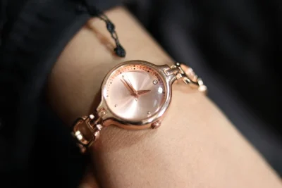 Cartier Baignoire watch guide: rose gold ladies watch with a small round dial on a wrist
