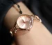 Cartier Baignoire watch guide: rose gold ladies watch with a small round dial on a wrist