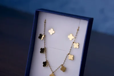 Gold clover motif necklace in a gift box, similar to a Vintage Alhambra necklace