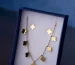 Gold clover motif necklace in a gift box, similar to a Vintage Alhambra necklace