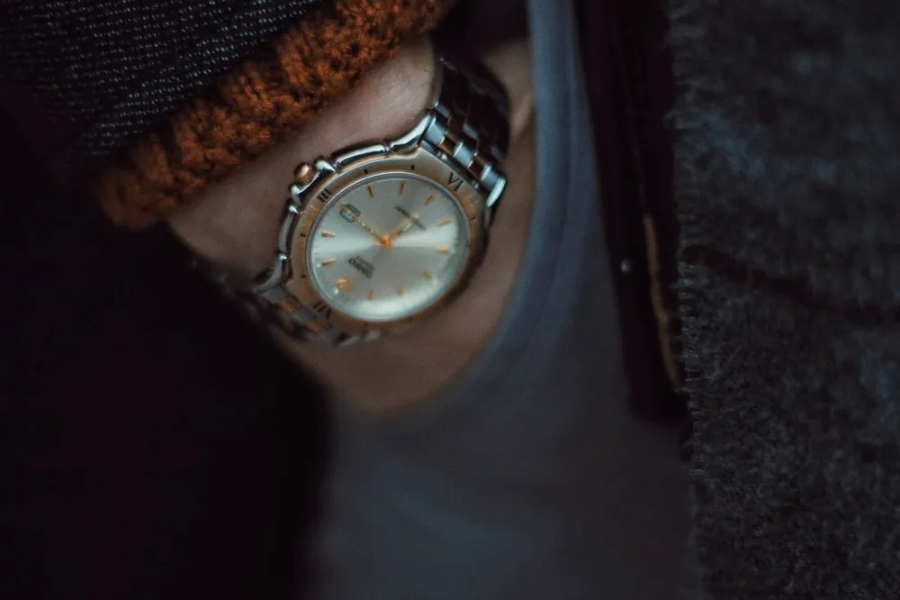 Cartier Santos medium vs large wrist fit: a steel wristwatch seen close up on the wrist